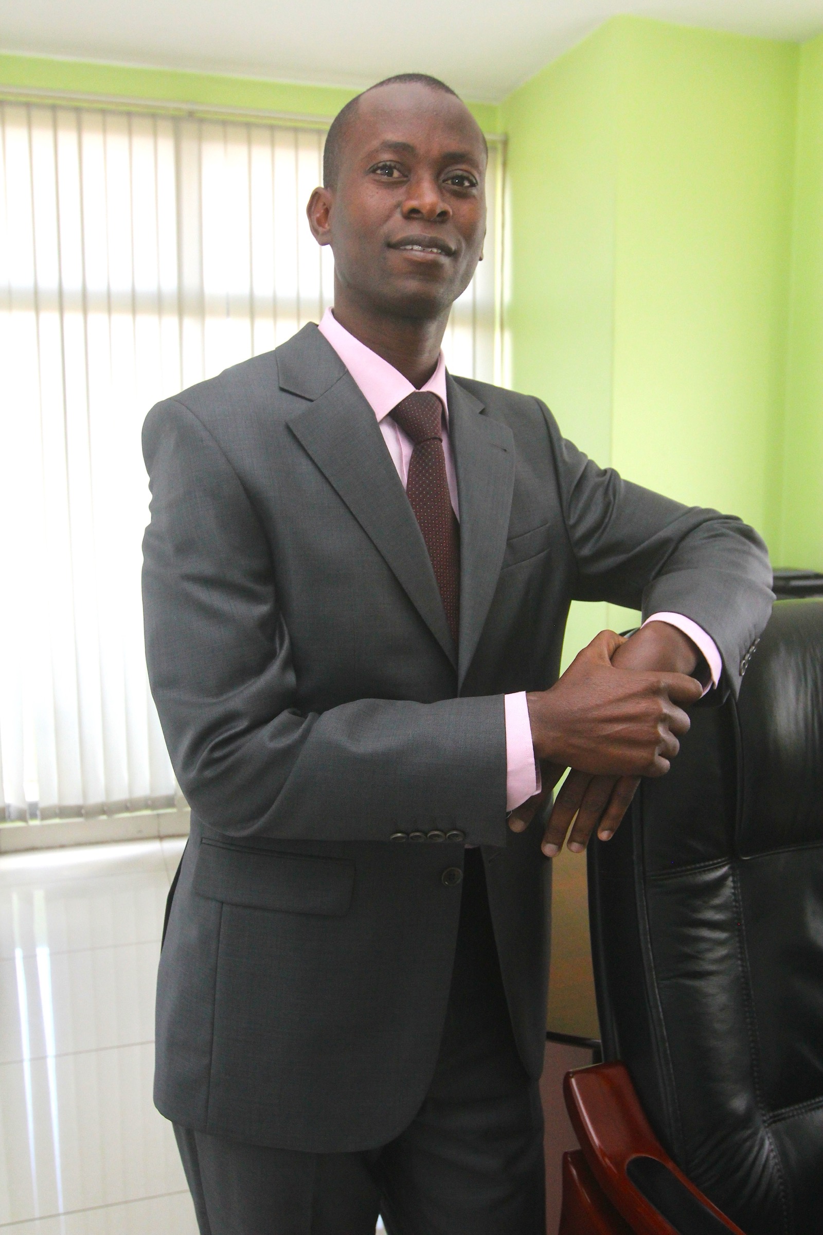 Charles O. Omondi, executive advisor, standing in his office